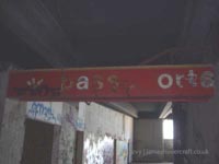 Passeports sign still half visible